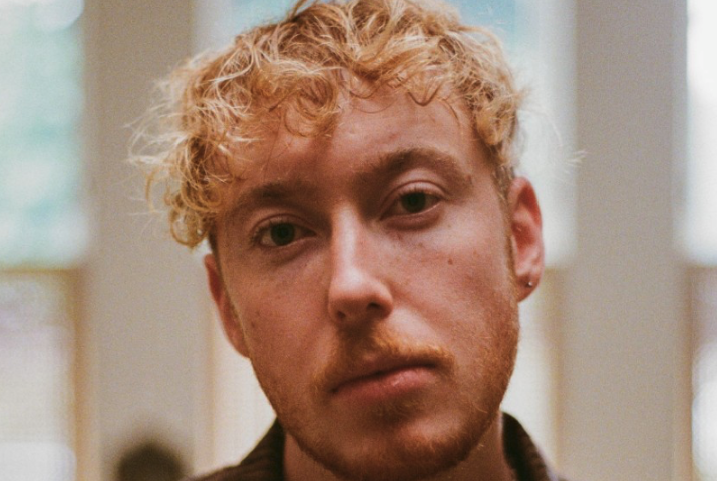 Singer Blair Davie looking down the camera